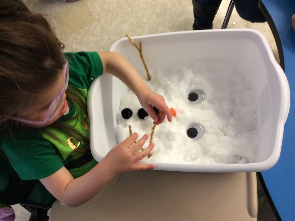 Making snow people.